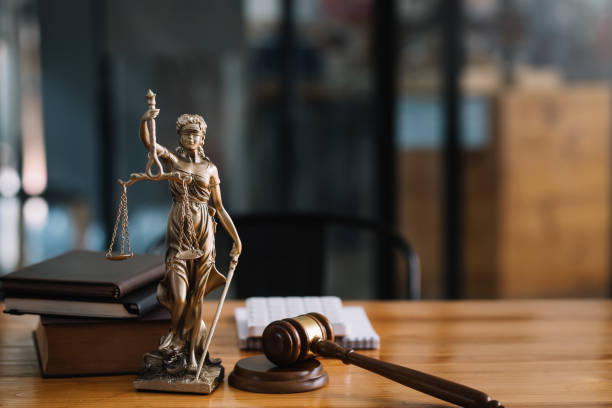 Statue of Lady Justice on the desk of a judge or lawyer